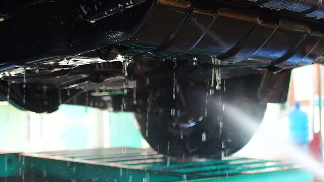Car Undercarriage Cleaning with High-Pressure Water for Auto Maintenance