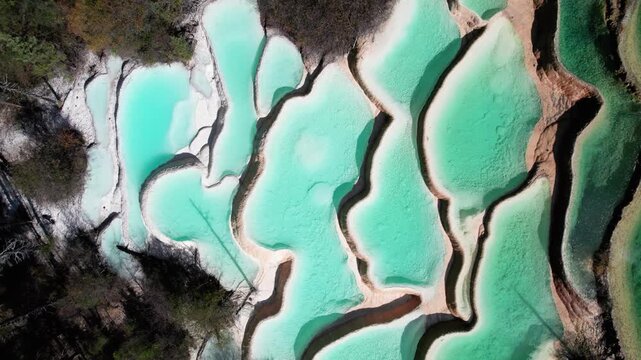 Drone view of Shenxianchi Scenic Area in Sichuan, China, near Jiuzhaigou and Huanglong, peaceful and clean water in pond among mountains, 4k real time footage travel concept.
