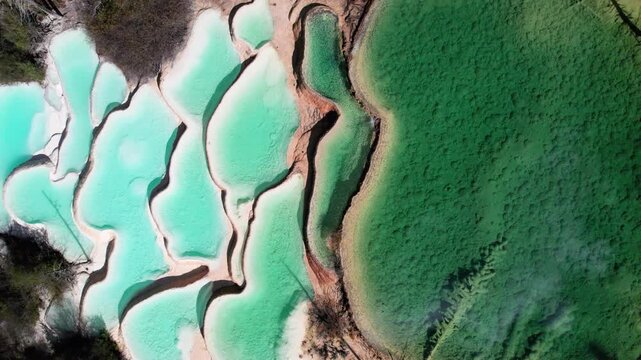 Drone view of Shenxianchi Scenic Area in Sichuan, China, near Jiuzhaigou and Huanglong, peaceful and clean water in pond among mountains, 4k real time footage travel concept.