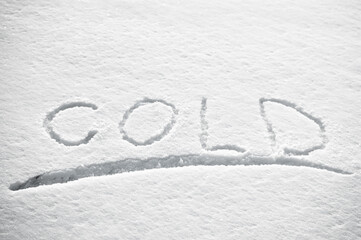 Snow background, photo of snow texture in winter and letters indicating that it is cold
