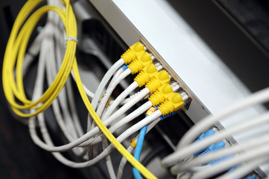 LAN internet network cable or RJ45 UTP fiber optic connect to network management equipment for cloud computing computer data link file transfer or wifi networking devices technology server system.