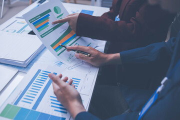 Fototapeta premium Accounting company provide finance and taxation planning for profitable cash flow, Auditor and accountant team working in office, analyze financial data and accounting record with calculator