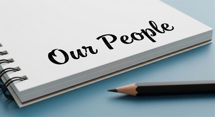 Obraz premium Our People text on spiral notebook, human resources concept on white paper, corporate culture and staff management message with pencil