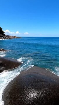 Waves crash on rocky ocean shore