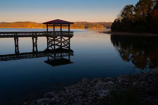 Fishing pier on Chickamauga Lake in the early morning just after sunrise in February at Booker T. Washington State Park in Tennessee