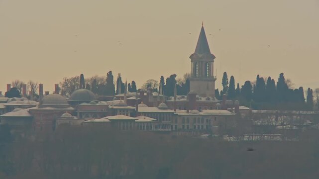 Topkapi Palace in Mist with Birds Flying in Foreground