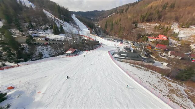 Winter FPV escapade: a fast flight over skiers and snowboarders on the slopes of Solisko in the Beskids.