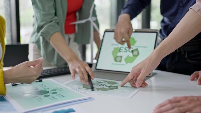 Young Asian business team discussion reusable product in office,start up eco-friendly business,environmental protection,sustainable business model,ESG strategy,team meeting,people work at home concept