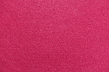 Fototapeta premium Close up of vibrant pink felt fabric texture