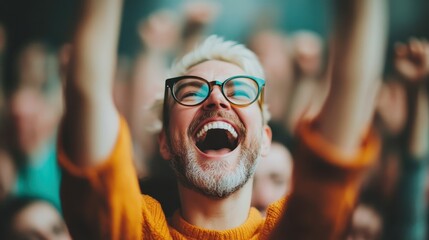 Fototapeta premium A jubilant concert-goer with glasses celebrates enthusiastically in the front row, capturing the euphoria of live music and the energy of an unforgettable event.