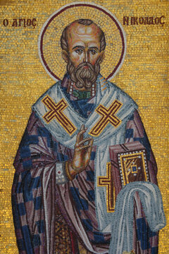 Close up Byzantine mosaic icon of Saint Nicholas with golden halo