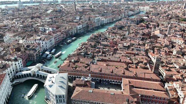 The historic Ponte di Rialto and dense terracotta roofs of Venice from above