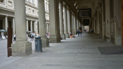 Blurred historic stone colonnade and covered walkway with shallow defocused bokeh in gallery  background backdrop copyspace calm. © Krakenimages.com