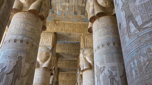 Dendera temple or Temple of Hathor. Painted columns with goddess faces and hieroglyphic ceiling of the hypostyle hall. Downscaled from 6k.