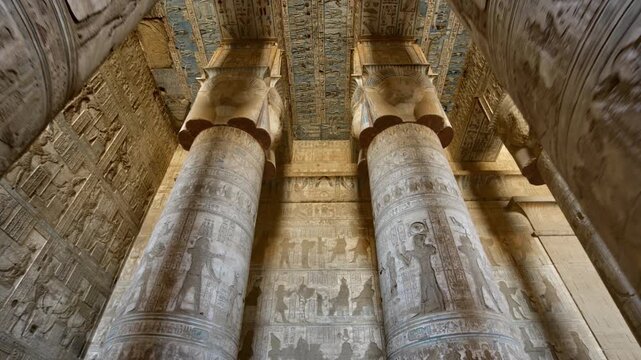 Dendera temple or Temple of Hathor. Painted columns with goddess faces and hieroglyphic ceiling of the hypostyle hall. Downscaled from 6k.