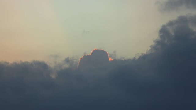 Golden Silver Lining Glowing Behind Thick Dark Storm Clouds
