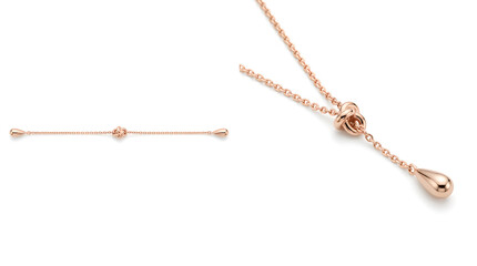 Fototapeta premium Close-up view of a gold necklace showcasing elegant chain, bead, and clasp details on white background from a studio perspective