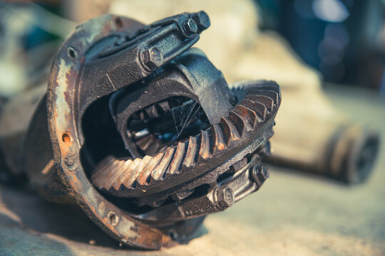 Close photo old spare part from the transmission gearbox of the car. Photo Theme: Car Repair and Broken Parts with Gears. High quality photo