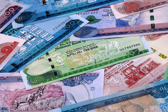 Ethiopian birr money bills pile on table. Ethiopia banknotes of ETB currency close up.