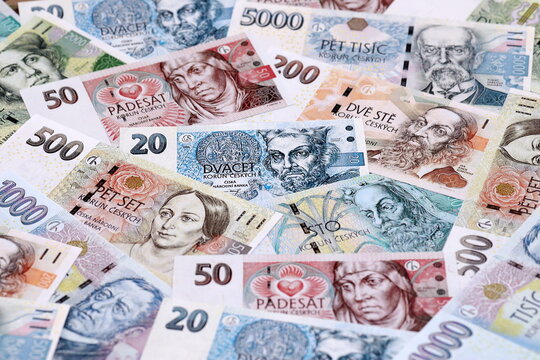 Czech koruna money bills pile on table. Czech Republic banknotes of CZK currency close up.