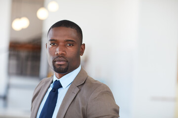 Fototapeta premium Serious, corporate and black man with portrait in office for career pride, about us and accountant. Space, male person and finance consultant with ambition, professional employee and investment firm