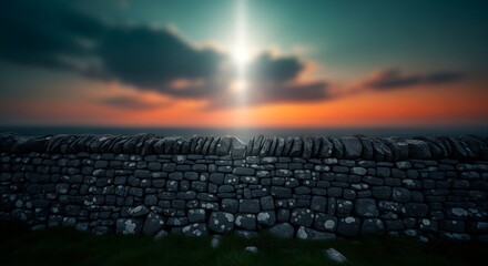 Obraz premium Stone wall at sunset with sun shining through clouds
