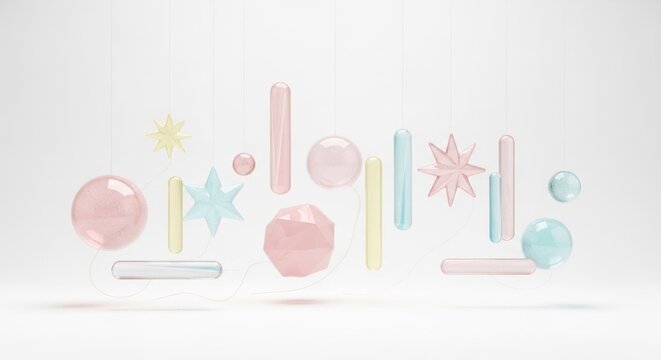 A colorful, abstract arrangement of geometric shapes and spheres hanging from a string against a white background.