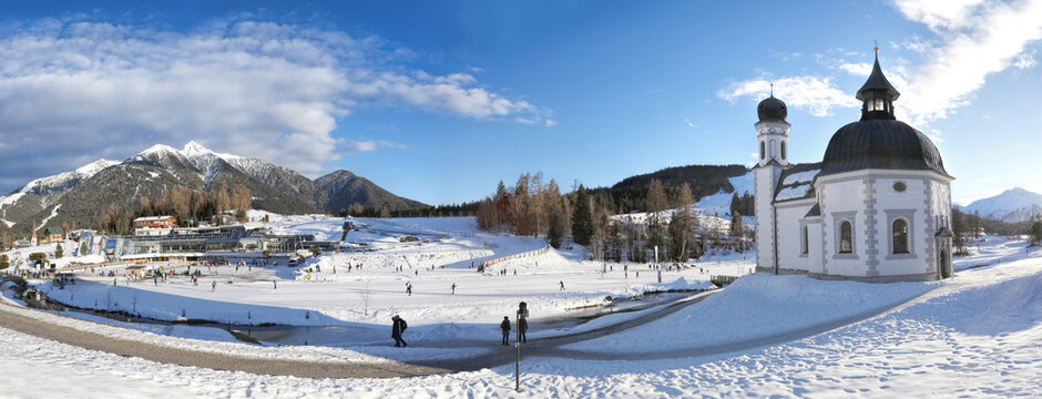 Winter panorama of Seefeld village with the church at sunset in in the Tyrolean Alps, Austria
