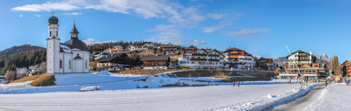 Winter panorama of Seefeld village with the church at sunset in in the Tyrolean Alps, Austria