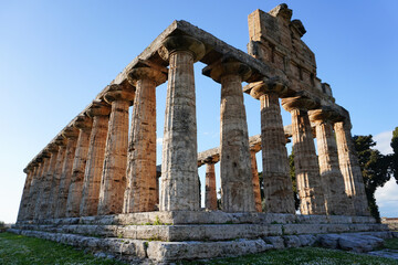 Fototapeta premium Ancient Greek Temple of Athena or Temple of Ceres. Ancient ruins. Paestum, Archaeological UNESCO World Heritage Site, Province of Salerno, Campania, Italy. 