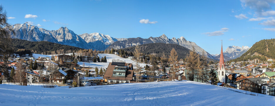 Winter panorama of Seefeld village with the church at sunset in in the Tyrolean Alps, Austria
