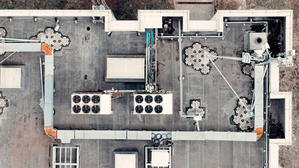 Industrial building roof with hvac systems and communication antenna