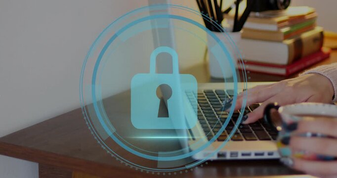 Man typing on laptop keyboard, keystrokes initiating cyber security HUD rings, padlock centering