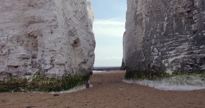 Wide zoom shot looking in between chalk stacks at botany Bay Beach at low tide. At marine Drive, Broadstairs