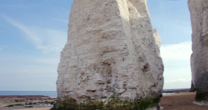 Shot panning left to right of the chalk stacks with sea in background at botany Bay Beach at low tide. At marine Drive, Broadstairs