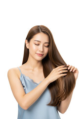 Fototapeta premium a youthful japanese woman with long, lustrous light brown hair gently caressing strands in a blue camisole on a transparent background, medium close-up. concept of luxurious hair care