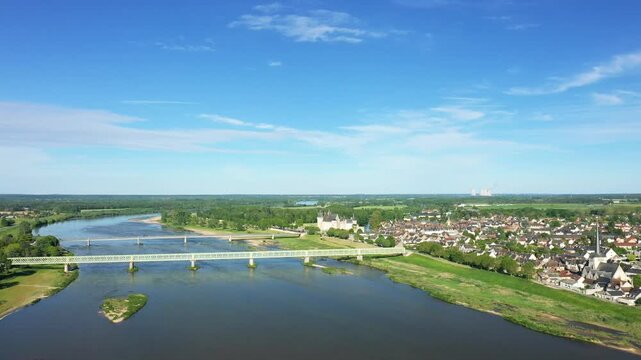 Scenic aerial panorama of Sully sur Loire with the Loire River, historic town, and green landscape under a clear blue sky.