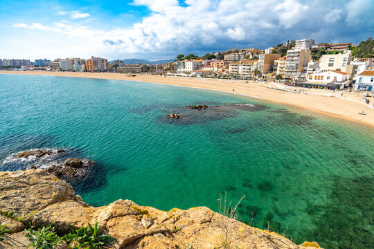 Blanes town stands along the beautiful sandy beach and turquoise waters of the mediterranean sea, offering a popular destination for summer travel and coastal holidays