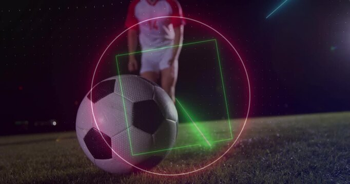 Animation of neon shapes and light trails against caucasian male soccer player kicking the ball