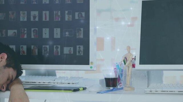 Animation of data processing over caucasian businessman sleeping next to computer