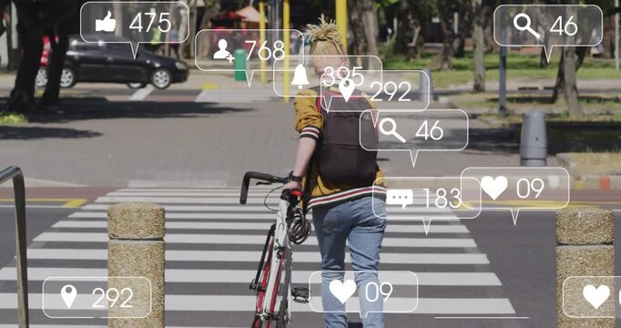 An albino african american man with dreadlocks crossing a street on his bicycle