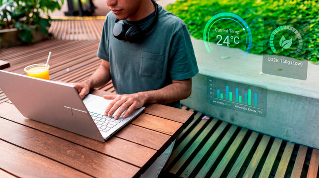 Responsible specialist reviewing air quality dashboard and managing renewable energy