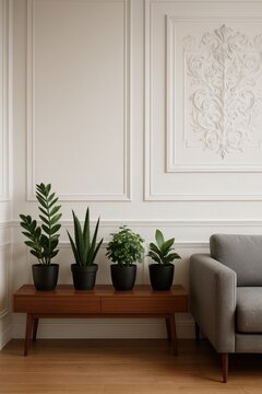 Green potted plants on wooden console table in elegant living room
