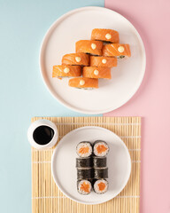 Roll and maki on a colorful background © Uliana