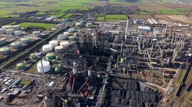 High angle aerial view of a massive petrochemical oil refinery in Immingham UK featuring industrial coking furnaces and processing units