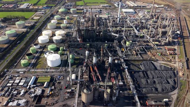 Aerial view of petrochemical Humber Refinery coking furnaces and industrial pipe network Immingham UK