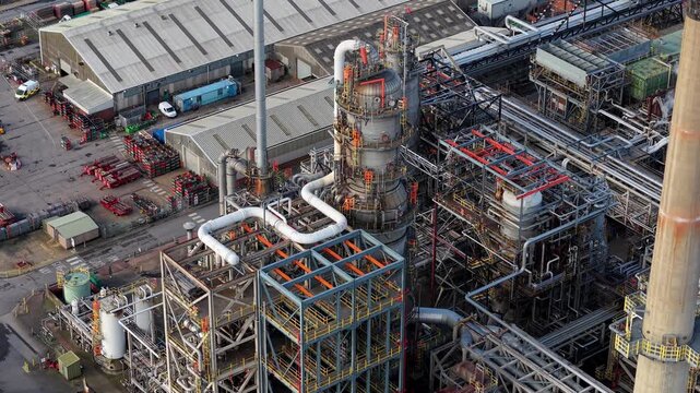 Aerial close-up of complex pipework and industrial processing systems at a major chemical manufacturing facility in Immingham, UK.