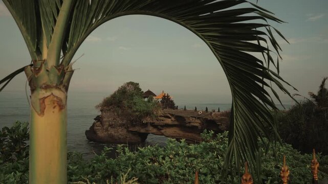 Breathtaking aerial view of of Tanah Lot Temple. Tanah Lot is a rock formation off the Indonesian island of Bali. It's home to the pilgrimage temple Pura Tanah Lot, a popular tourist and cultural icon
