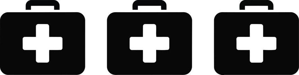 Obraz premium Three black first aid kits with white cross symbols arranged in a row.