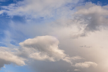 Obraz premium Dramatic cloudy sky with soft light and blue background